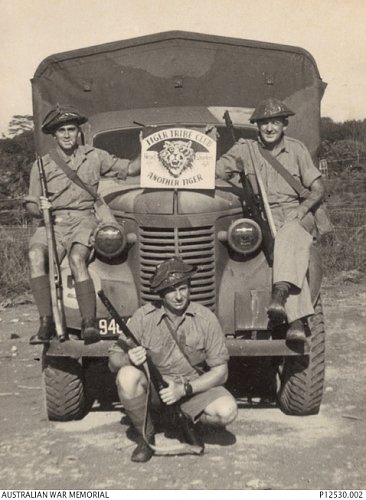 Click image for larger version

Name:	P12530.002  Malaya  c. Dec 1941  men of HQ 8th Div pose in front of 1940 Chev truck (note camo).jpg
Views:	5
Size:	56.9 KB
ID:	82318