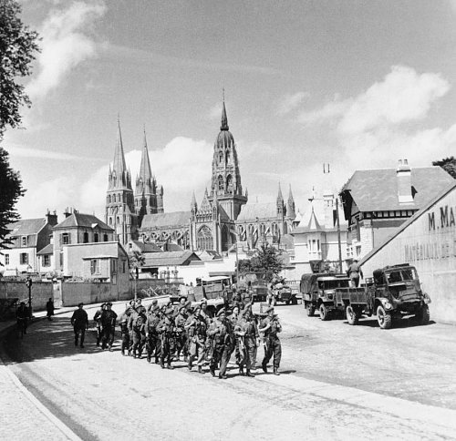 Click image for larger version

Name:	British_troops_marching_through_Bayeux_in_Normandy%2C_27_June_1944._B6058.jpg
Views:	24
Size:	114.4 KB
ID:	73539