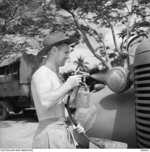 Click image for larger version

Name:	008503  MALAYA, 1941-07. AN ARMY LORRY GETS A COAT OF CAMOUFLAGE..JPG
Views:	1
Size:	214.9 KB
ID:	82326