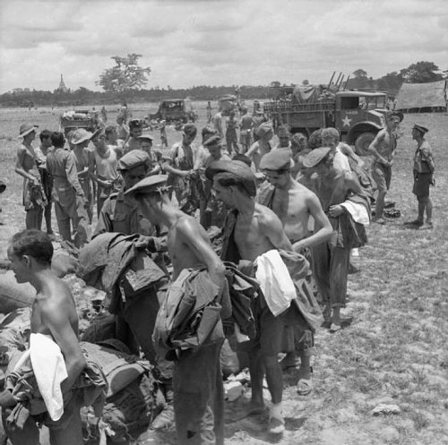 Click image for larger version

Name:	Liberated POWs abandoned by the Japanese at Pegu and rescued by the advancing 14th Army queuing .jpg
Views:	16
Size:	81.1 KB
ID:	66549