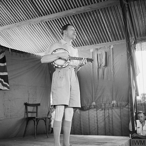 Click image for larger version

Name:	GEORGE FORMBY ENTERTAINS NORTH AFRICA TROOPS, 1943.jpg
Views:	2
Size:	95.7 KB
ID:	115740