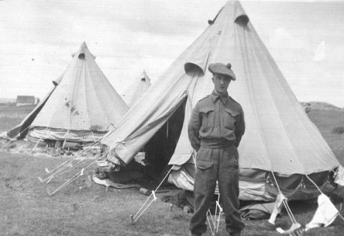 Click image for larger version

Name:	Jim Wilkinson in front of Bell tents while involved in the defence of Newfoundland, Botwood, New.jpg
Views:	20
Size:	53.7 KB
ID:	71340